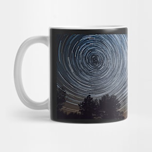 Starry night sky, startrails between trees landscape Mug